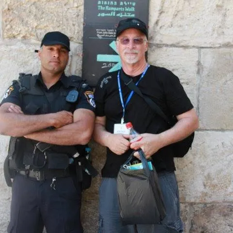 Steve beside a stone wall in Israel
